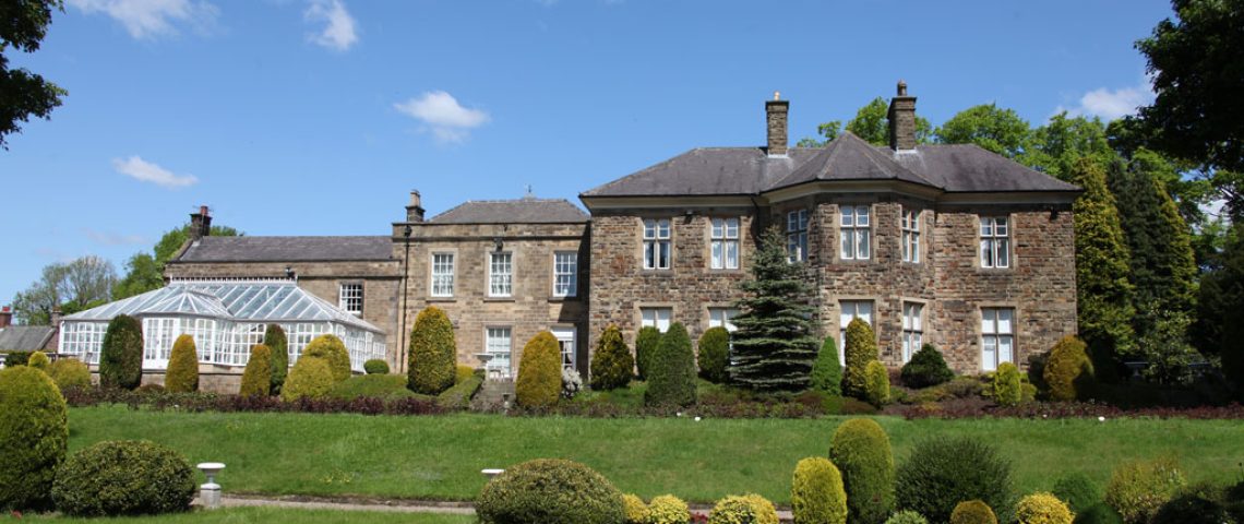 Hallfield Hall, a stone country house with manicured gardens and a garden room